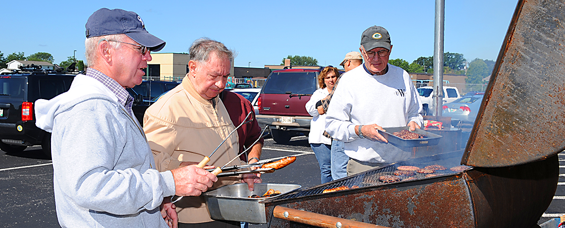 Men in Mission grilling at the church picnic